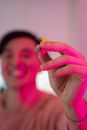 Woman Holding Yellow Flower in Close Up Photography