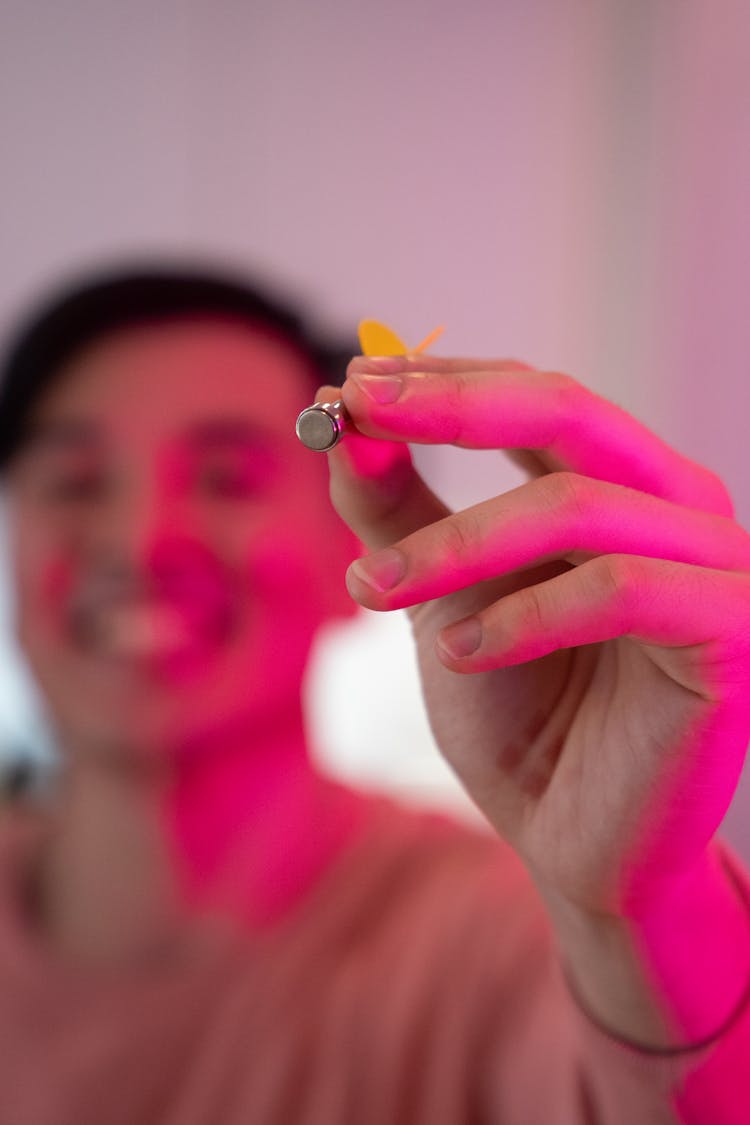 A Man Holding A Magnetic Dart