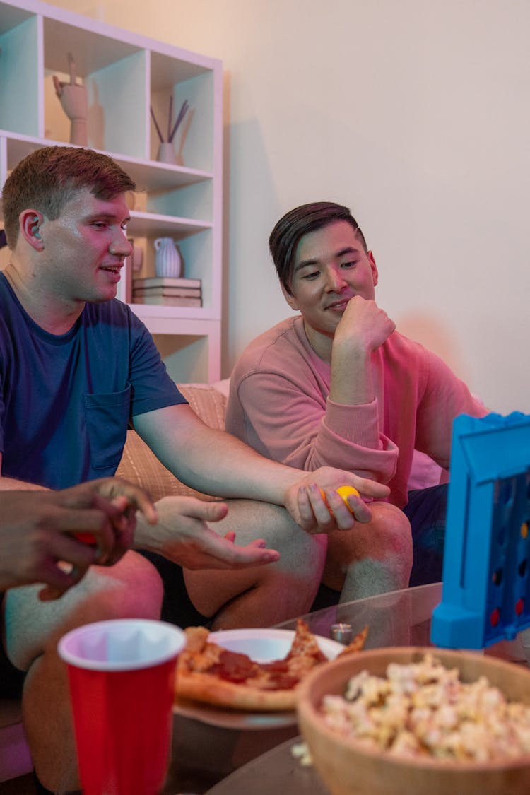 Men Playing Connect Four