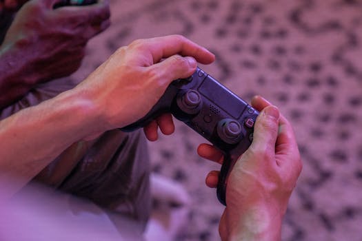 Close-up of hands gripping a video game controller, perfect for gaming themes.