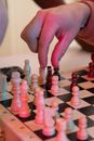 Person Holding Pink and White Beads