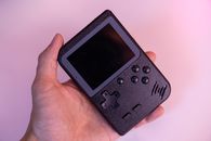 A Hand Holding a Game Boy