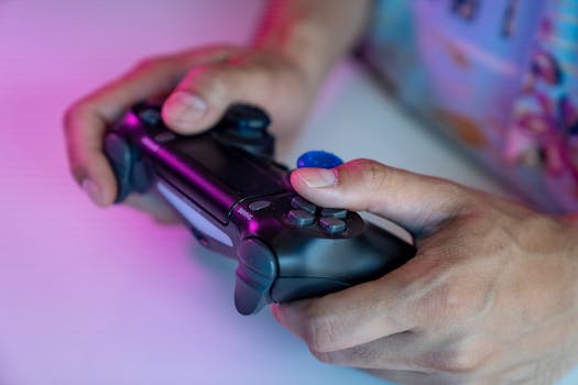 A detailed shot of hands gripping a video game controller, ideal for gaming themes.