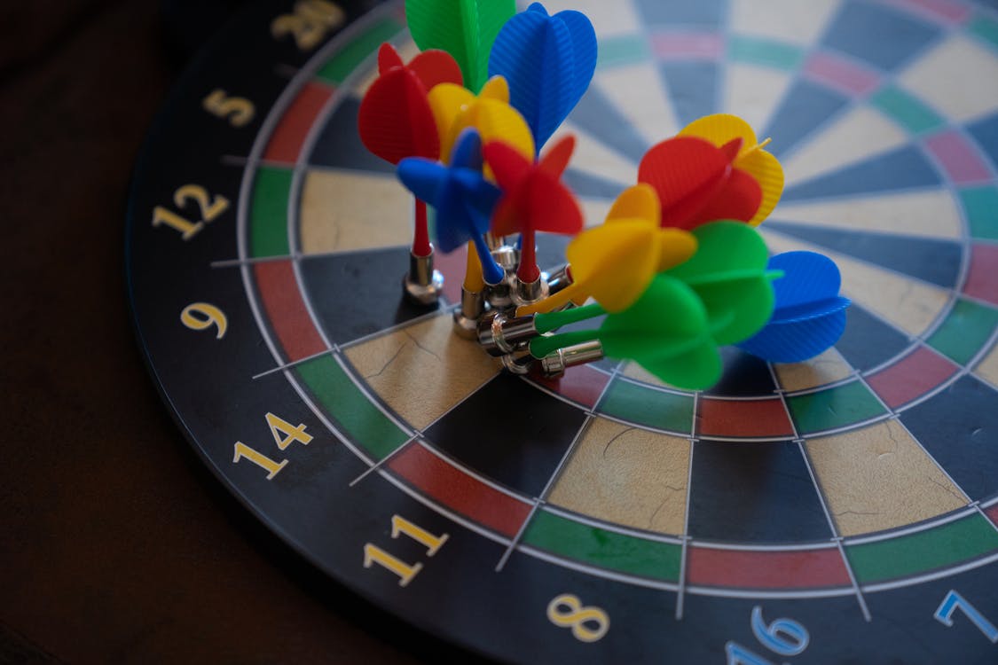 Free Magnetic Darts on Dartboard Stock Photo