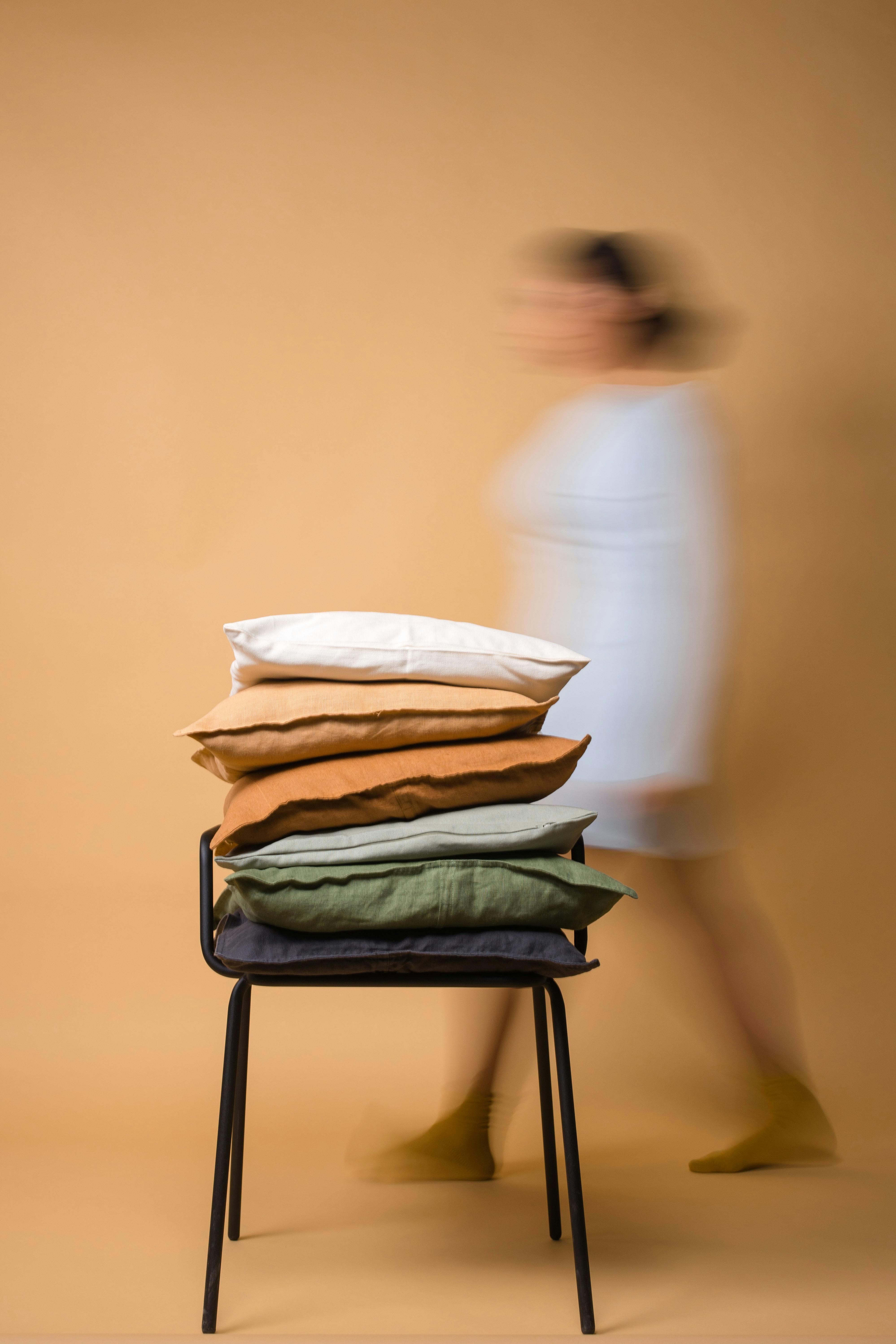 Throw Pillows on a Chair · Free Stock Photo