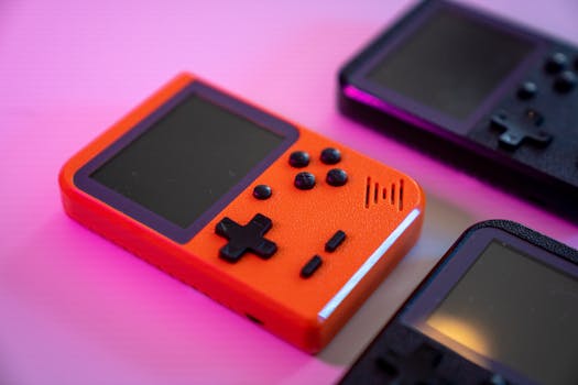 Vibrant and nostalgic handheld gaming console in focus, showcasing retro design with a pop of color.
