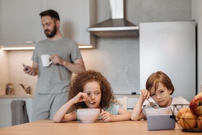 Two children having breakfast at a kitchen table — photo by Pavel Danilyuk on Pexels