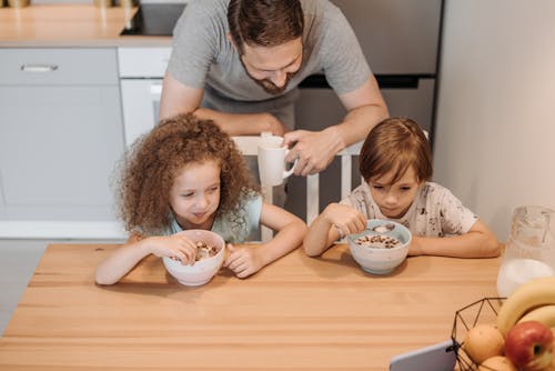 Free A Father Looking His Children While Eating Stock Photo