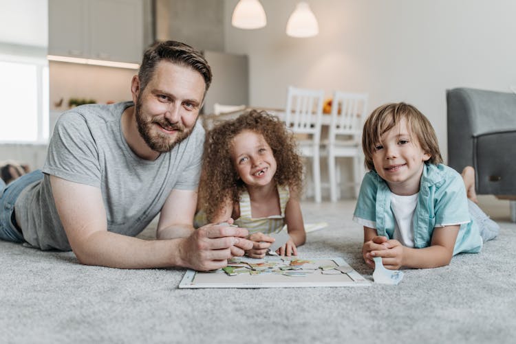 A Man Playing With His Children