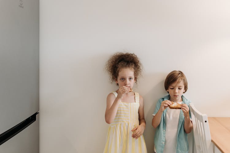 Children Eating A Sandwich