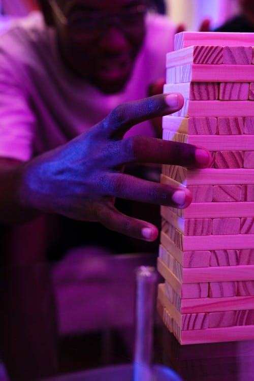 A Man Playing Jenga