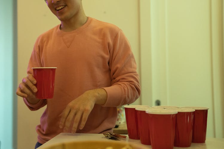 Man With Plastic Cup At Party