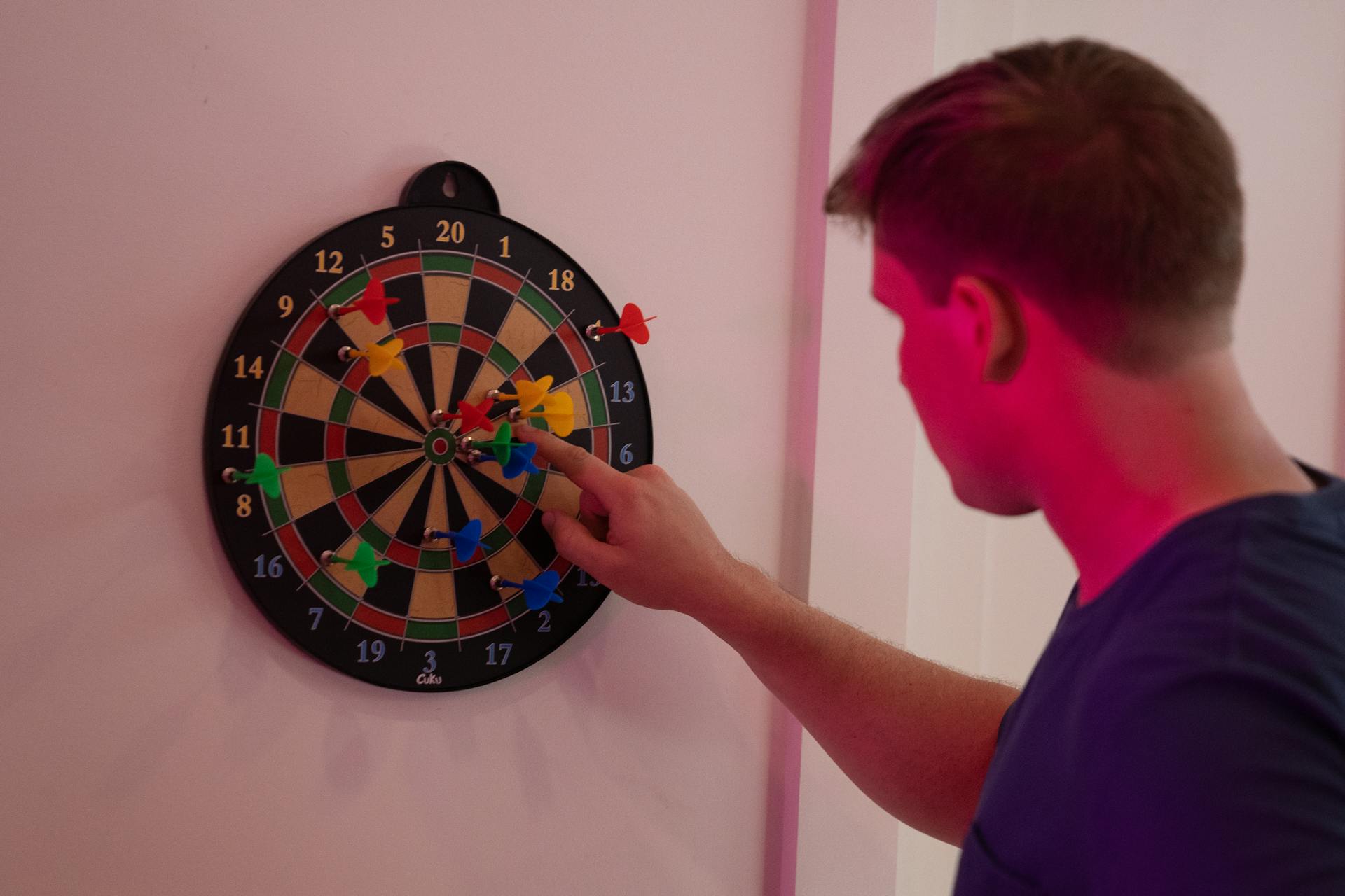 Man Counting Points From a Dart Game