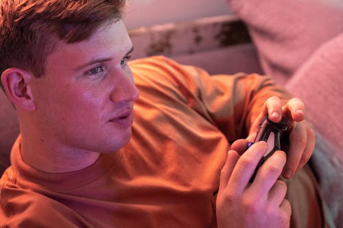 Man Playing a Video Game and Holding Joystick 