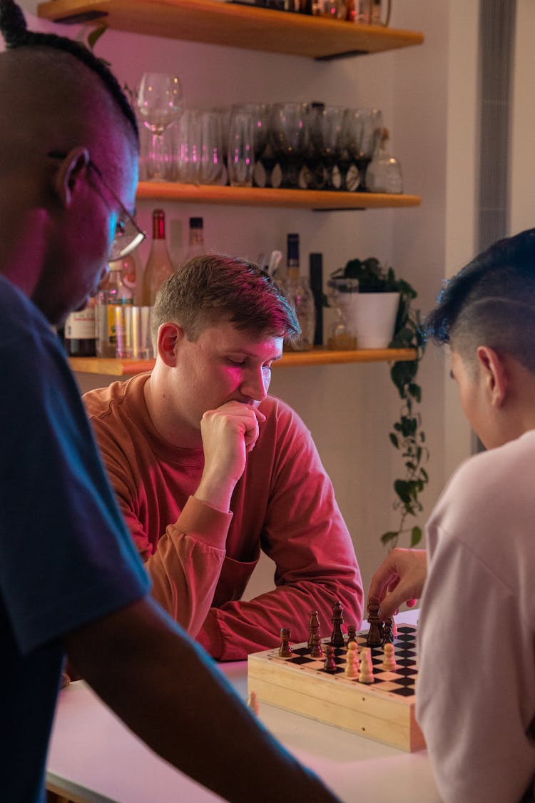 Guys Playing Chess At Party