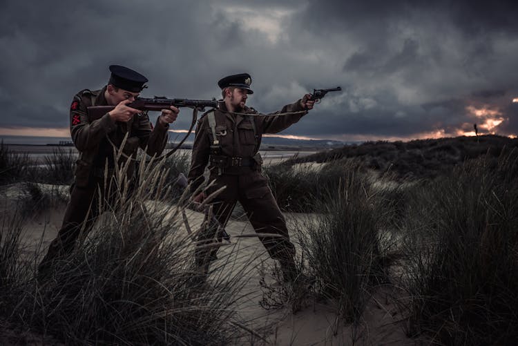 Two Man Holding Rifle And Pistol Illustration