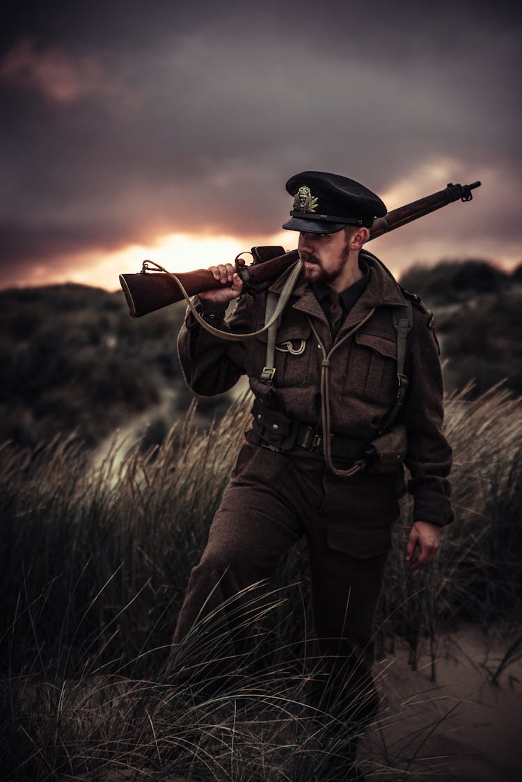 Photo Of A Man Holding A Gun