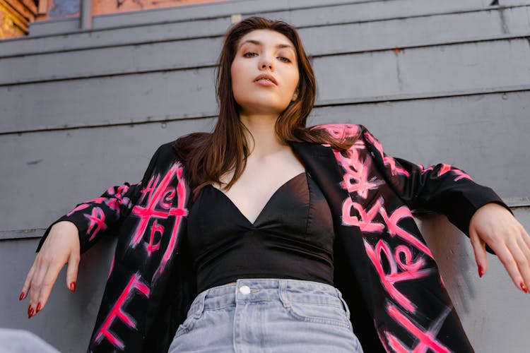 Low Angle Shot Of A Woman Wearing Black Blazer Looking At The Camera