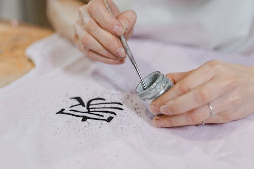 Close-up Photo of Asian Calligraphy using Glitter Paint 