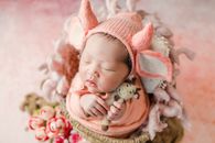 Baby in Pink Knit Cap and Pink Knit Cap