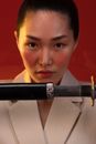 A Woman Unsheathing a Sword