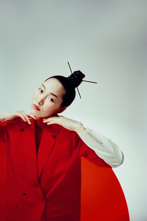 Elegant Woman Holding a Red Transparent Screen 