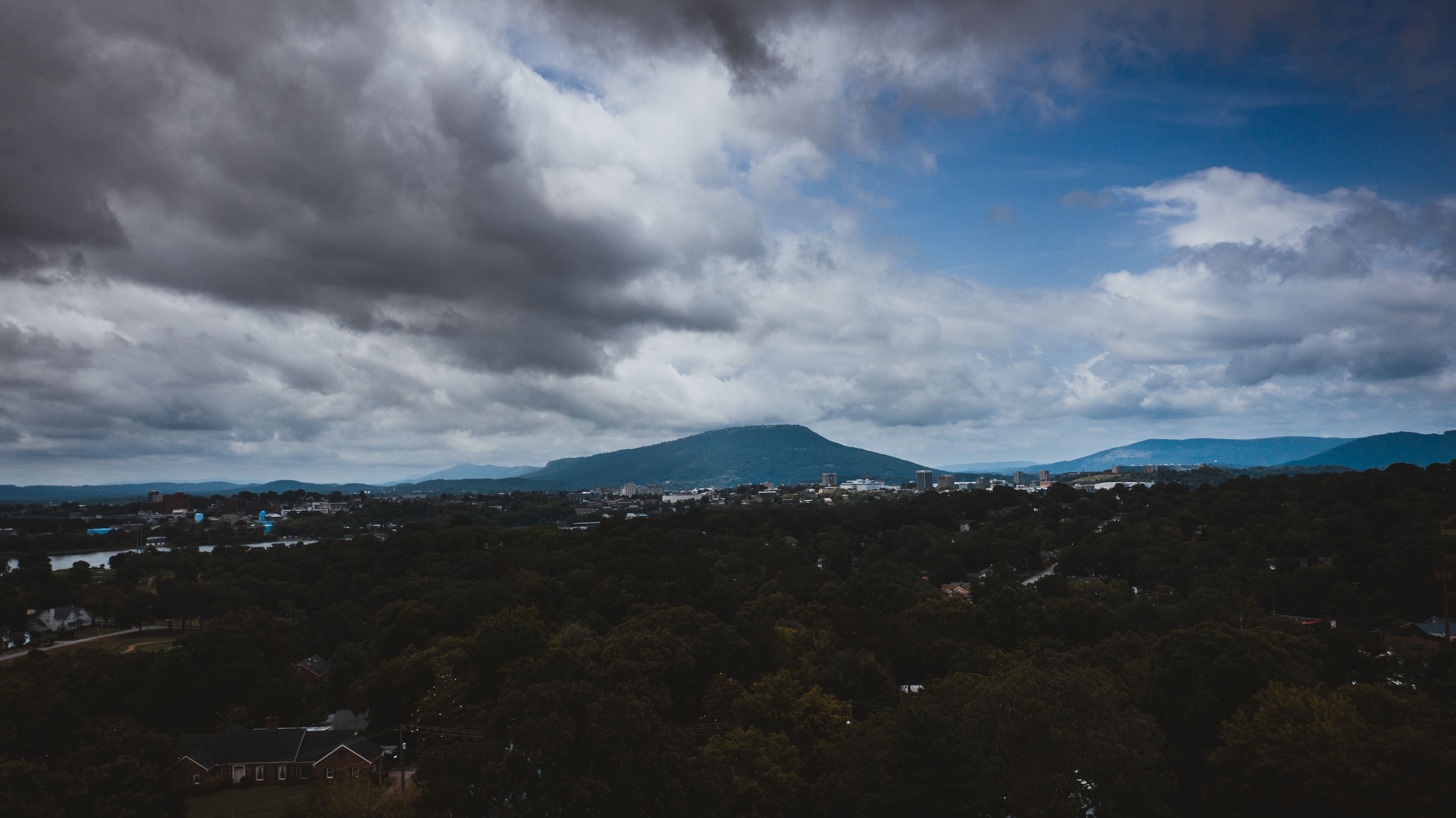 Aerial Photography of Green Trees Under Cloudy Sky · Free Stock Photo
