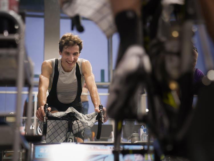 A Man Exercising Using Indoor Bike