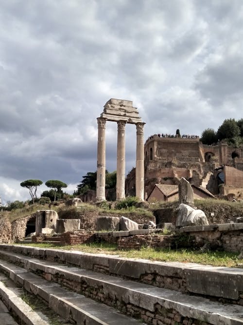 Concrete Pillars Under Cloudy Sky