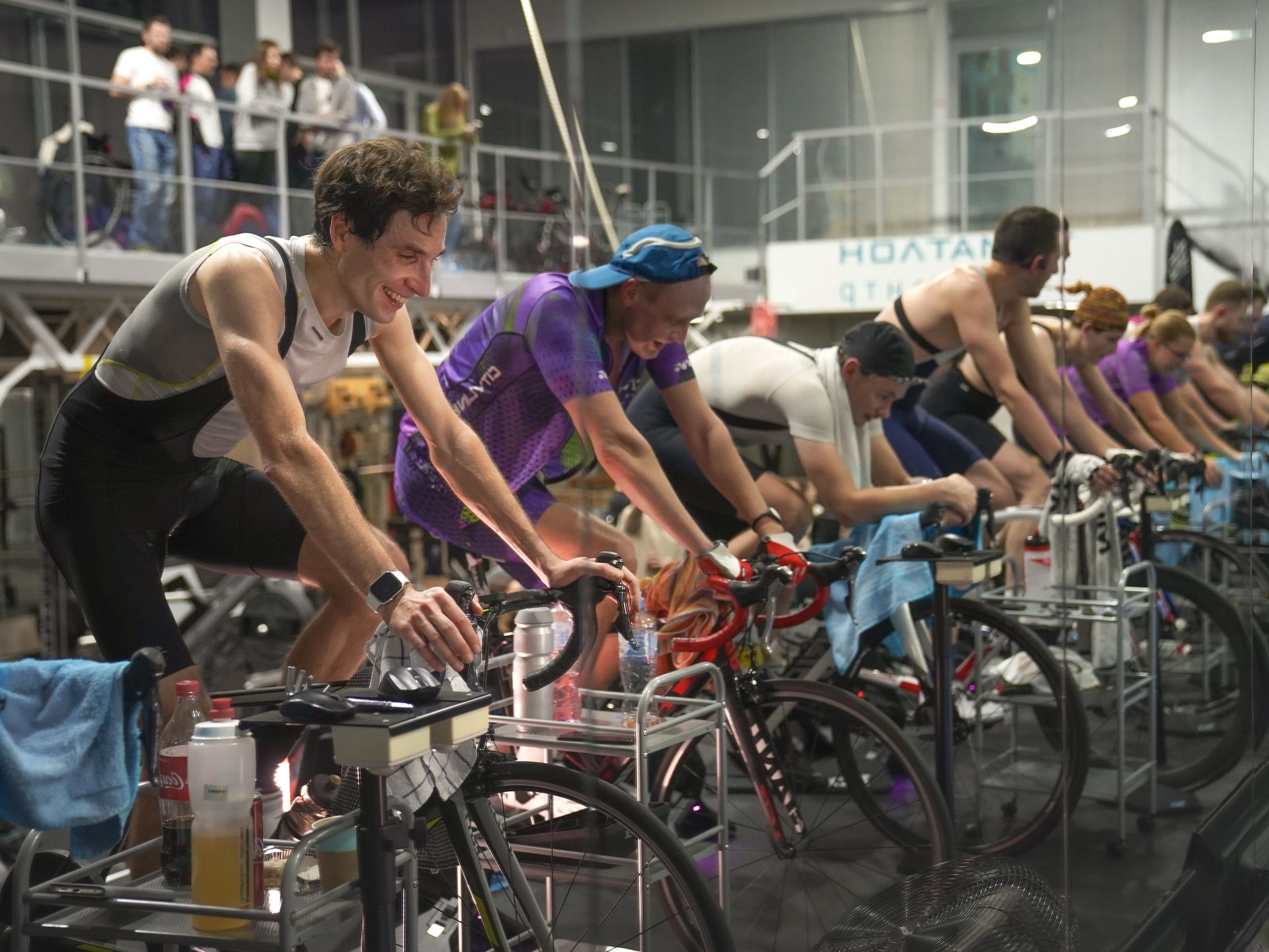 Group in an indoor cycling session with focused participants