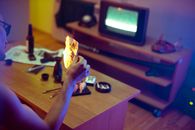 Person Holding Black Game Controller