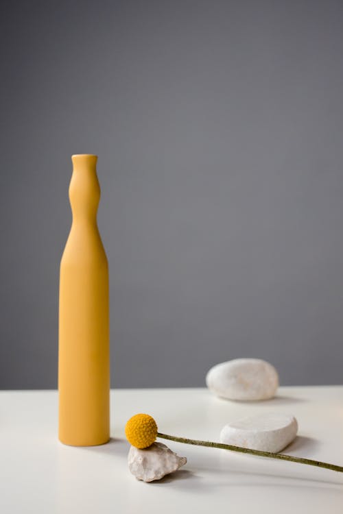 Modern Yellow Vase Standing on White Surface 