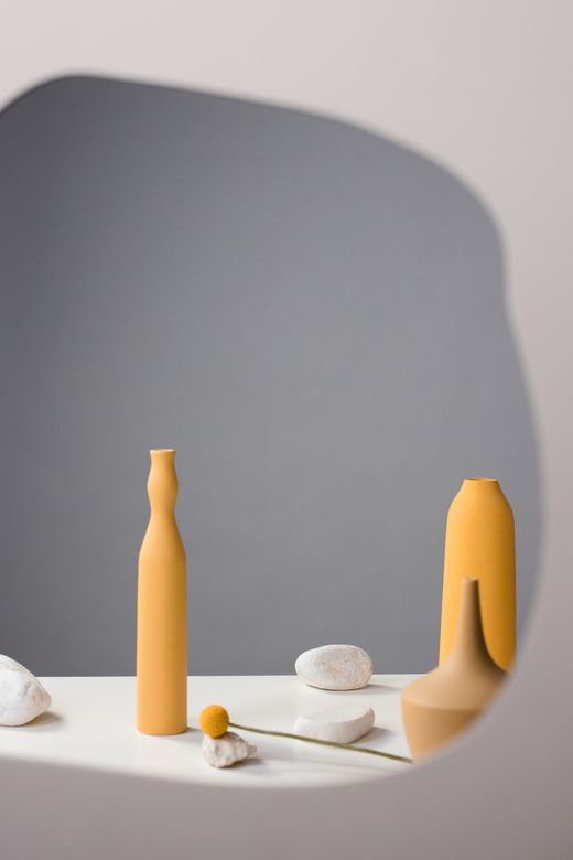 Yellow vases and stones — Photo by Ron Lach on Pexels