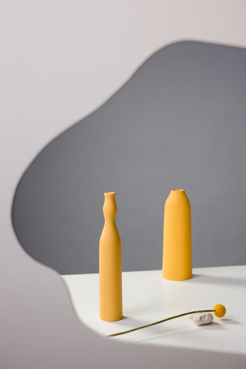 Yellow Ceramic Vases on White Table