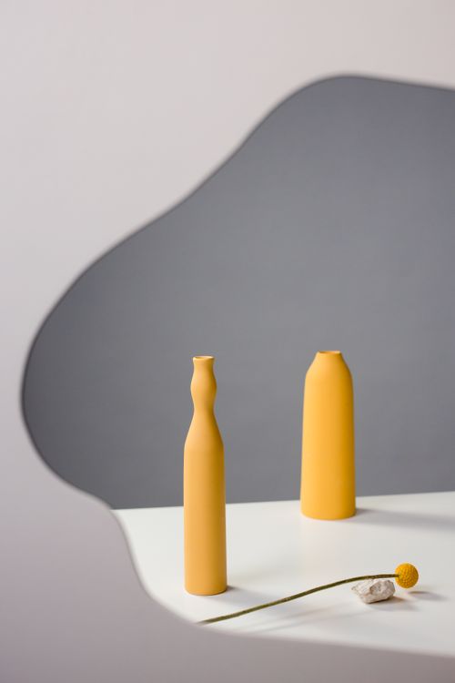 Free Two yellow ceramic vases in a minimalist still life setting, featuring copy space and artistic composition. Stock Photo