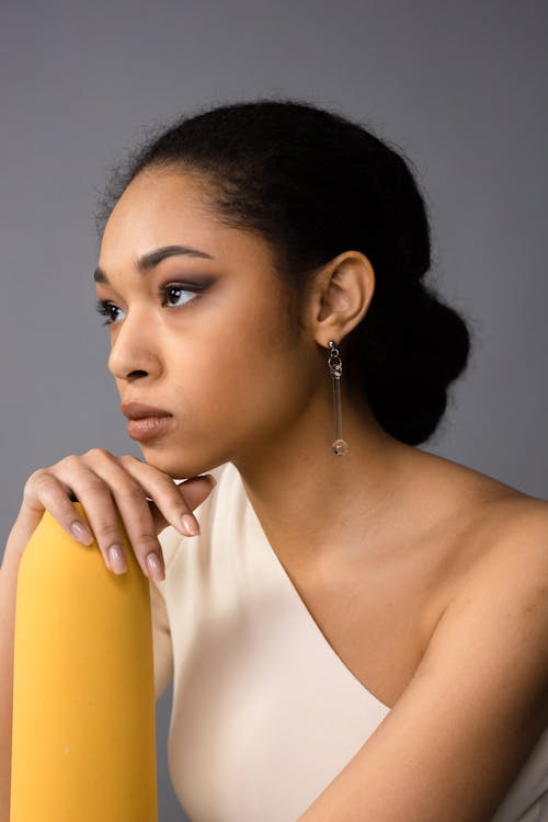 Studio Portrait of a Young Elegant Woman Looking Away 