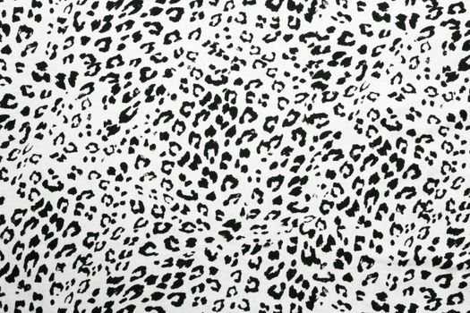 High-resolution image of black and white cheetah pattern fabric, ideal for textile design.