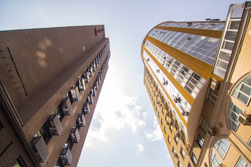 Brown Concrete Building Under White Sky