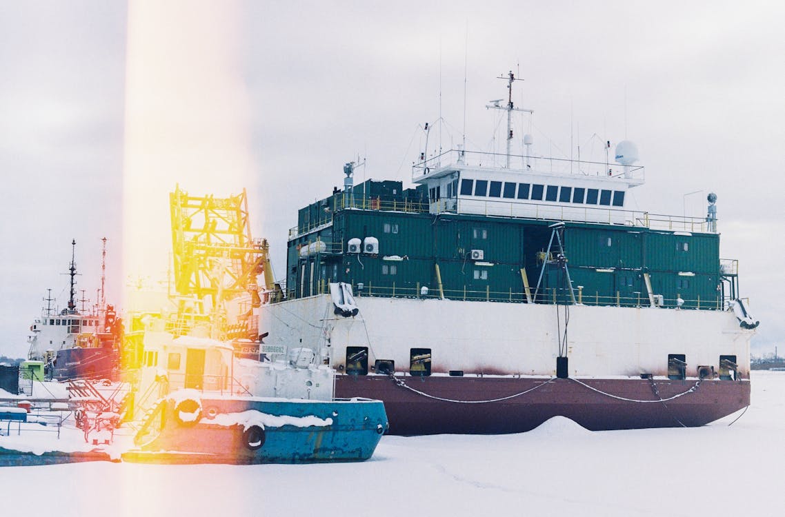 Cargo Ship docked on a Pier 