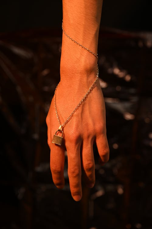 Free Chain Necklace on Person's Hand Stock Photo