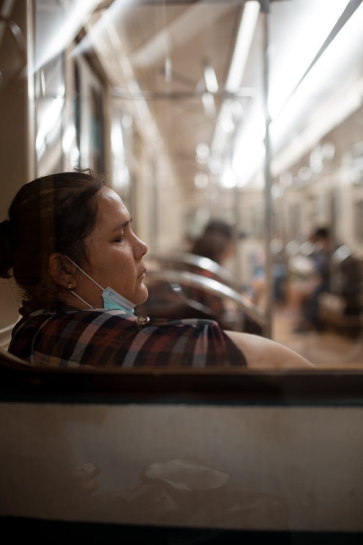 A Woman Riding A Train