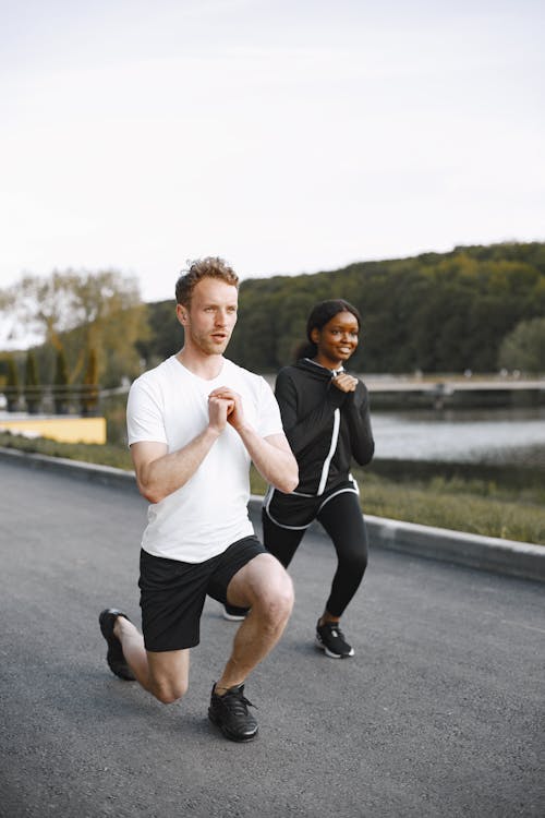 Free Woman and Man Doing Warm Up Exercise Stock Photo