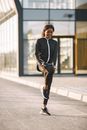 Woman in Black Activewear Standing in One Leg