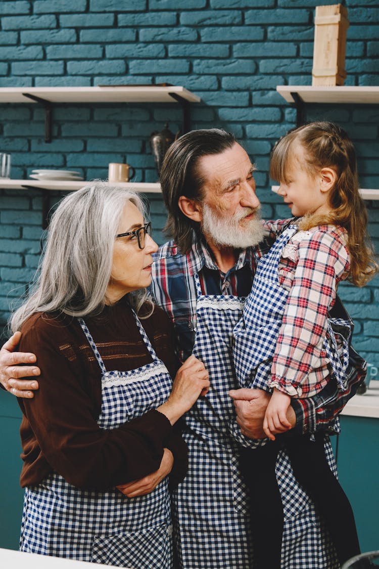 Grandparents Looking At Their Grandchild