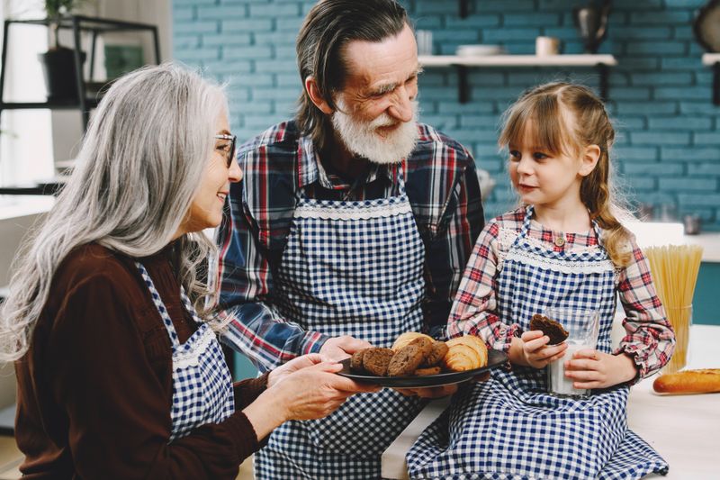 Grandparents bonding with their grandchild at home