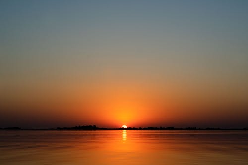 Free Scenic View of a Placid Sea during Sunset Stock Photo