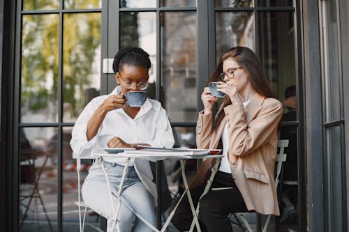 Free Women Having a Cup of Coffee Stock Photo
