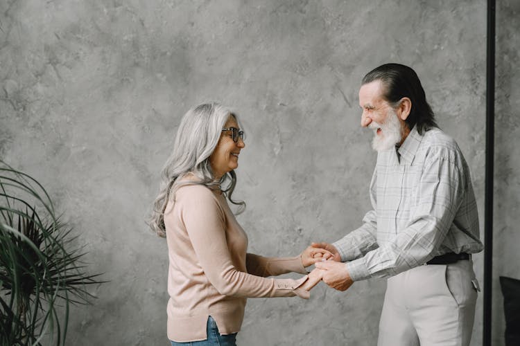 Happy Elderly Couple Dancing Together