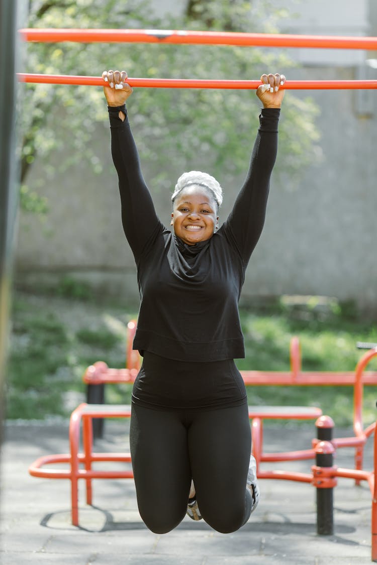 Woman Doing Monkey Bar Exercise