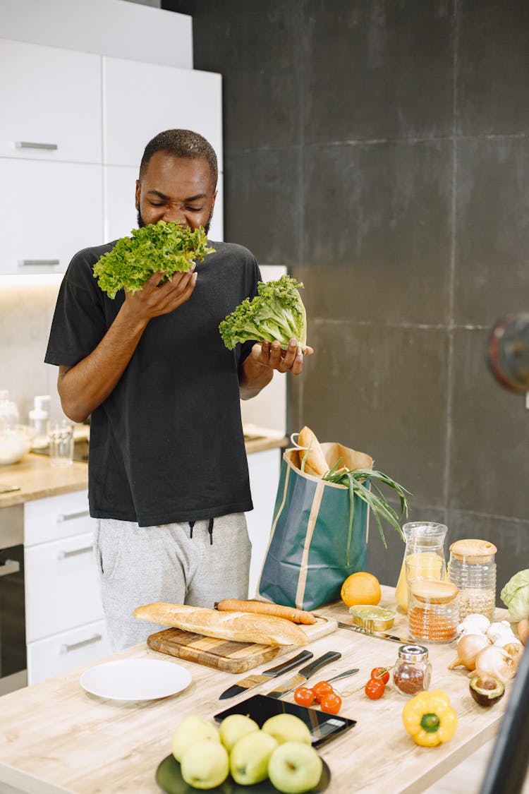 Man Eating Lettuce Vegetable